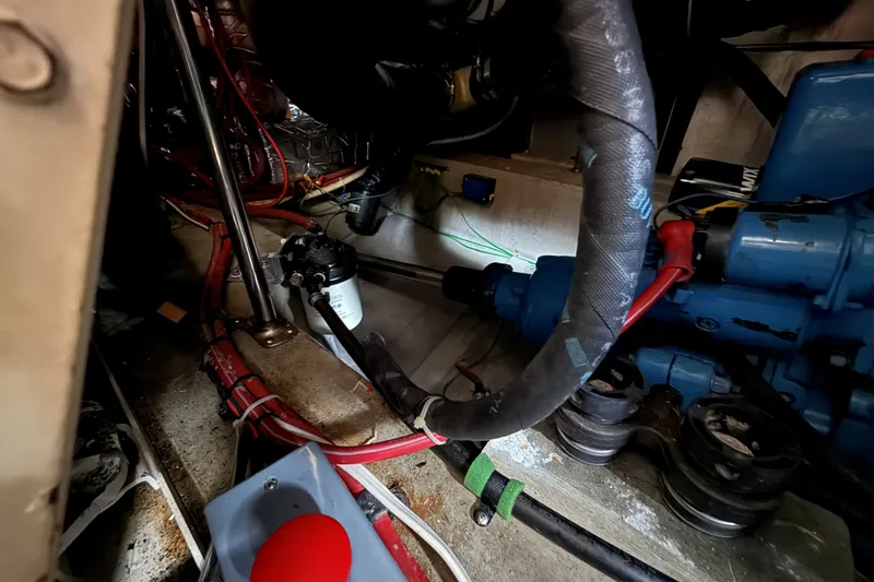 Slide: The Image of Engine room of 1988 Carver 38 Aft Cabin Motor Yacht with visible components. - 48