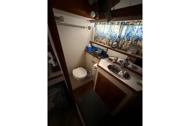 Slide: The Image of Bathroom interior of 1988 Carver 38 Aft Cabin Motor Yacht with sink and toilet. - 31