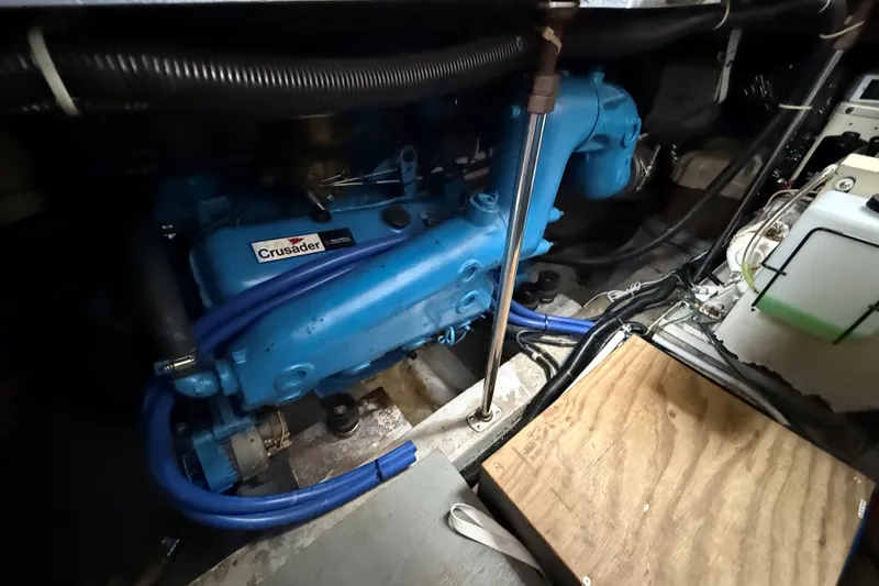Slide: The Image of Engine room of 1988 Carver 38 Aft Cabin Motor Yacht with Crusader engine. - 46