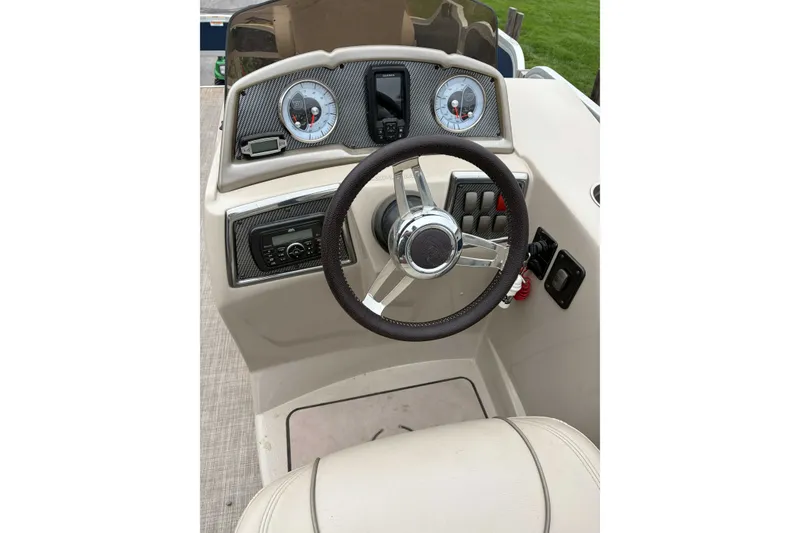 Slide: The Image of Steering console of a 2017 Premier 200 Explorer boat with gauges and controls. - 5