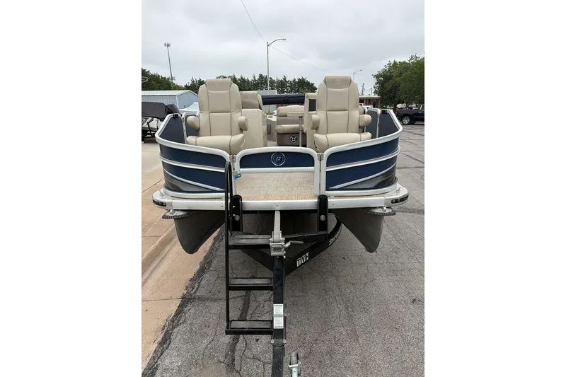 Slide: The Image of 2017 Premier 200 Explorer pontoon boat with beige seating on a trailer. - 1