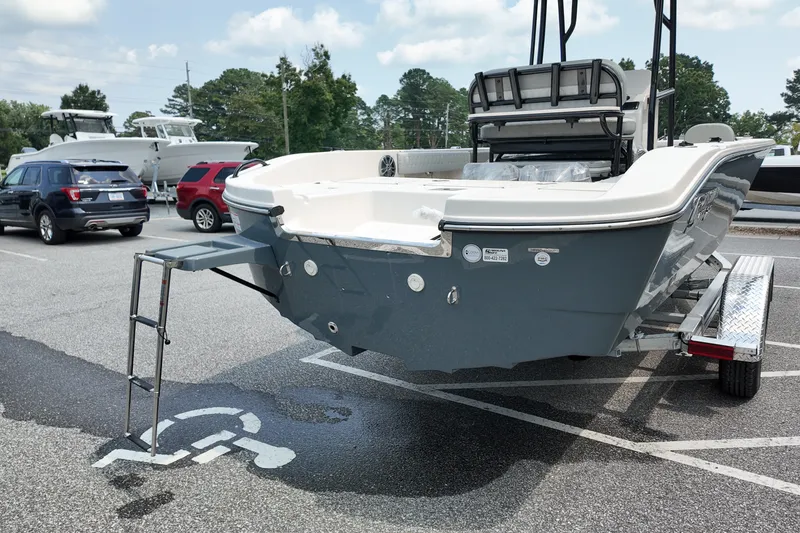 Slide: The Image of 2027 Carolina Skiff 22 Ultra Elite boat on trailer in parking lot. - 4