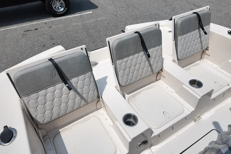 Slide: The Image of 2027 Carolina Skiff 22 Ultra Elite boat seats with cup holders, showcasing modern design. - 6