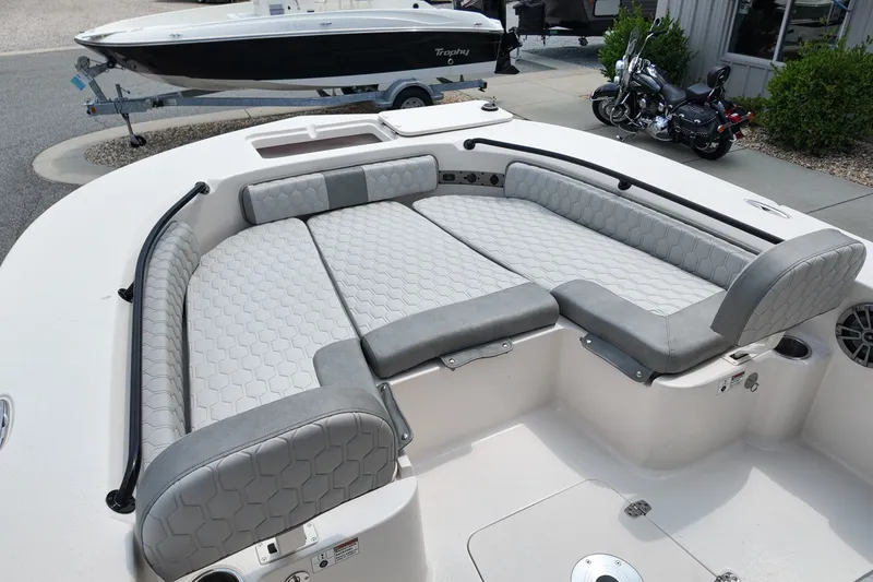 Slide: The Image of 2027 Carolina Skiff 22 Ultra Elite boat interior with cushioned seating and modern design. - 9