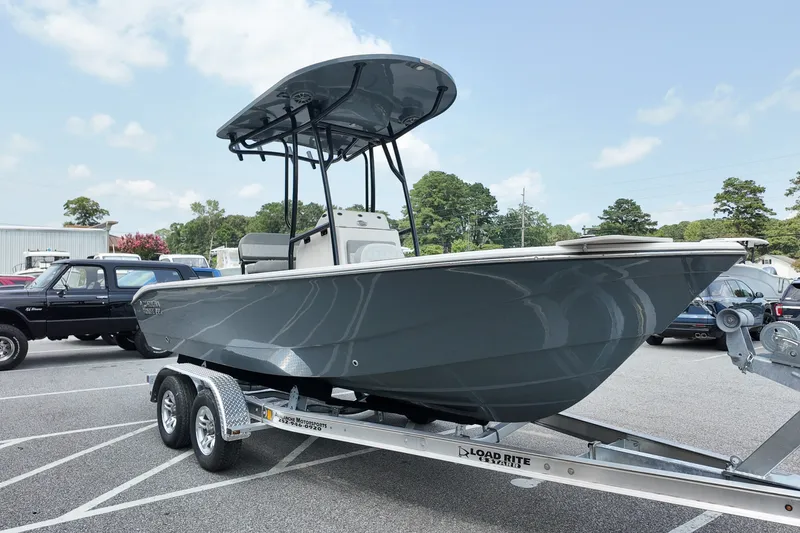 Slide: The Image of 2027 Carolina Skiff 22 Ultra Elite boat on trailer in parking lot. - 3