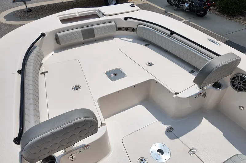 Slide: The Image of 2027 Carolina Skiff 22 Ultra Elite boat interior with cushioned seating and storage compartments. - 8