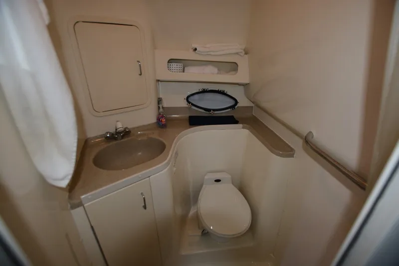 Slide: The Image of Bathroom interior of 2001 Chris-Craft 328 Express Cruiser with sink and toilet. - 13