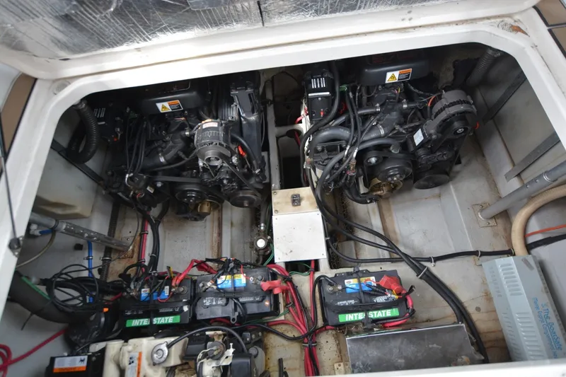 Slide: The Image of Engine compartment of 2001 Chris-Craft 328 Express Cruiser with dual engines and batteries. - 14
