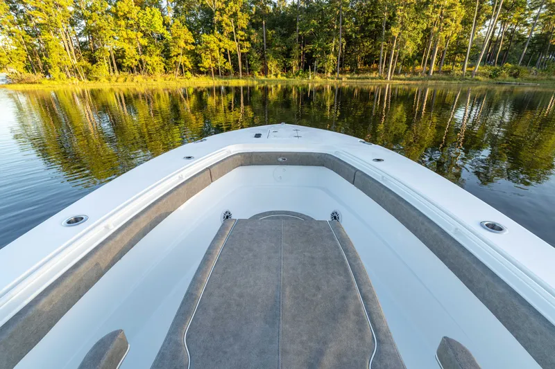 Slide: The Image of Bow view of 2027 Sea Hunt Ultra 305SL boat on calm lake. - 19