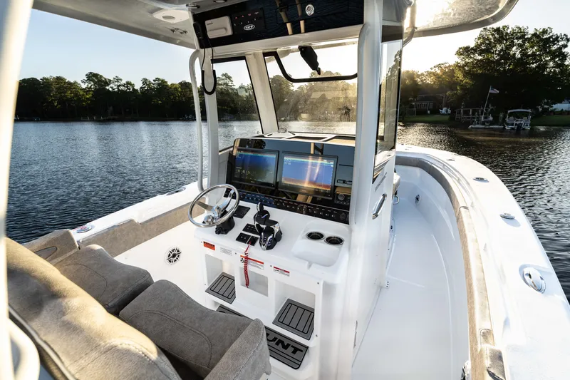 Slide: The Image of Interior view of 2027 Sea Hunt Ultra 305SL boat with advanced navigation system. - 29