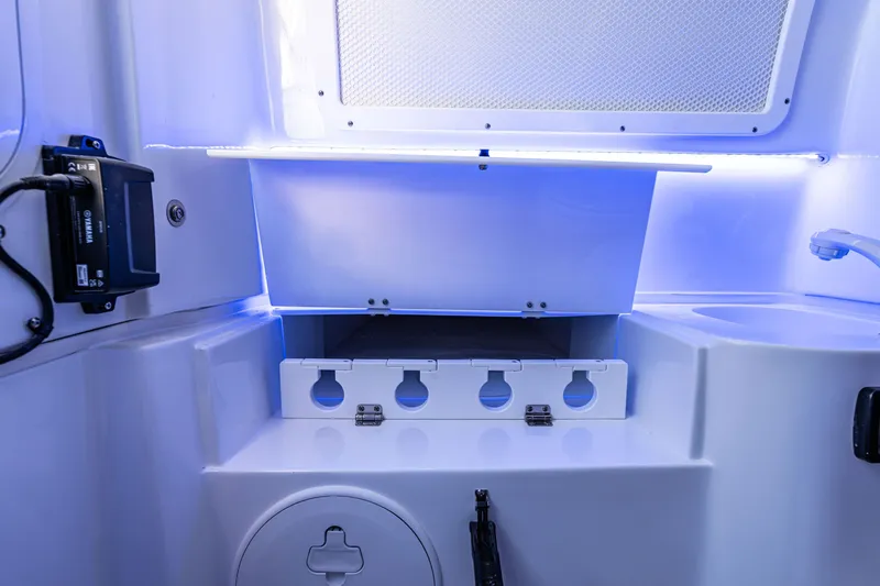 Slide: The Image of Interior of 2027 Sea Hunt Ultra 305SL boat with storage compartments and LED lighting. - 32