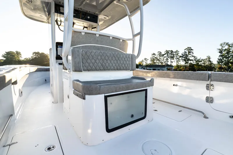 Slide: The Image of 2027 Sea Hunt Ultra 305SL boat interior with cushioned seating and modern design. - 28