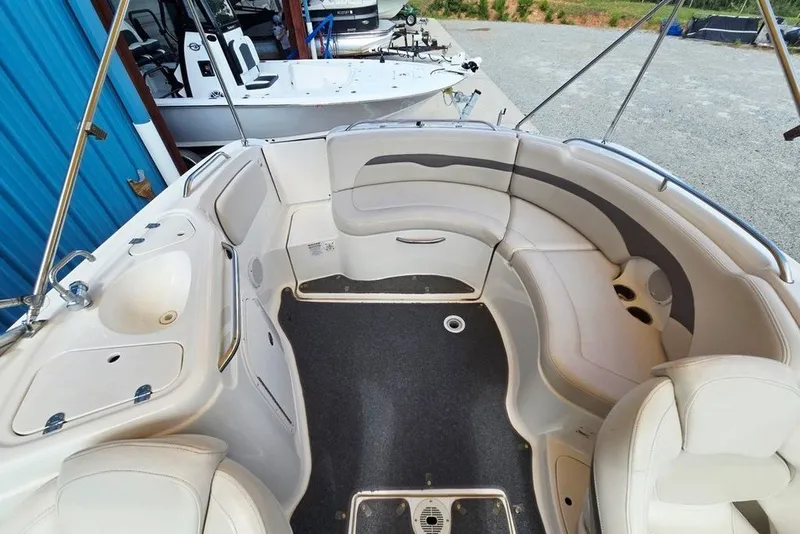 Slide: The Image of 2005 Chaparral Sunesta 254 boat interior with spacious seating and sink area. - 6