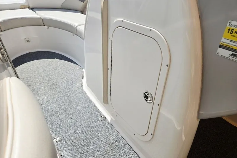 Slide: The Image of Interior view of a 2005 Chaparral Sunesta 254 boat with seating and storage compartment. - 29