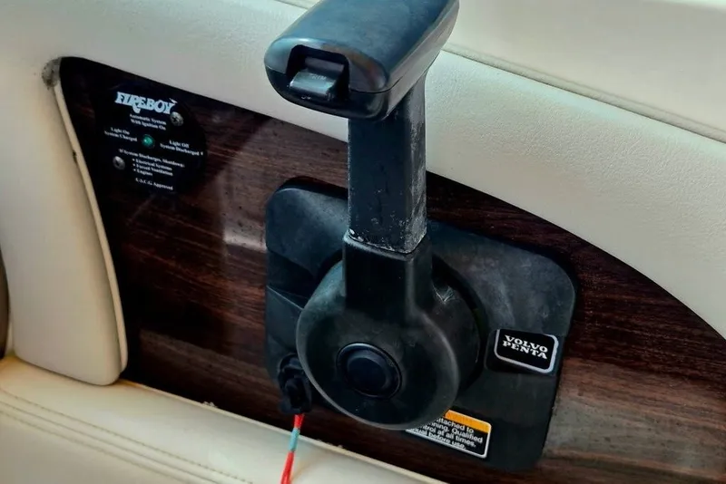 Slide: The Image of Throttle control lever on a 2005 Chaparral Sunesta 254 boat dashboard. - 7