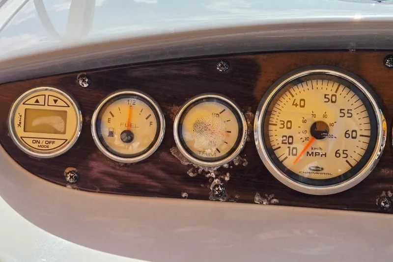 Slide: The Image of Dashboard of a 2005 Chaparral Sunesta 254 boat with gauges and controls. - 17