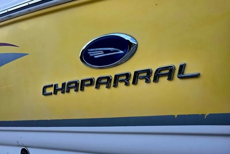 Slide: The Image of 2005 Chaparral Sunesta 254 boat logo on yellow background. - 31