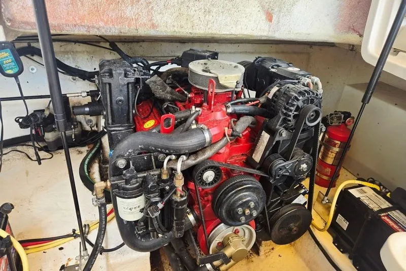 Slide: The Image of Engine compartment of a 2005 Chaparral Sunesta 254 boat, featuring a red engine. - 8