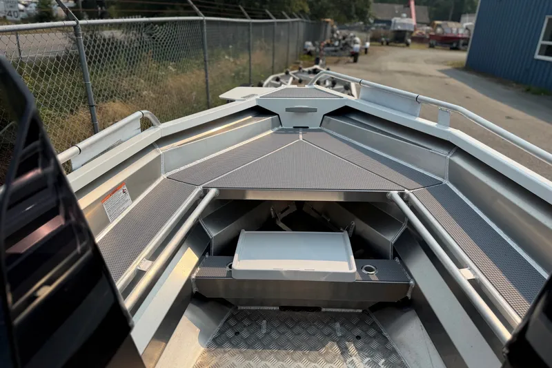 Slide: The Image of 2025 Stabicraft 1450 Explorer boat interior with aluminum deck and storage compartments. - 3