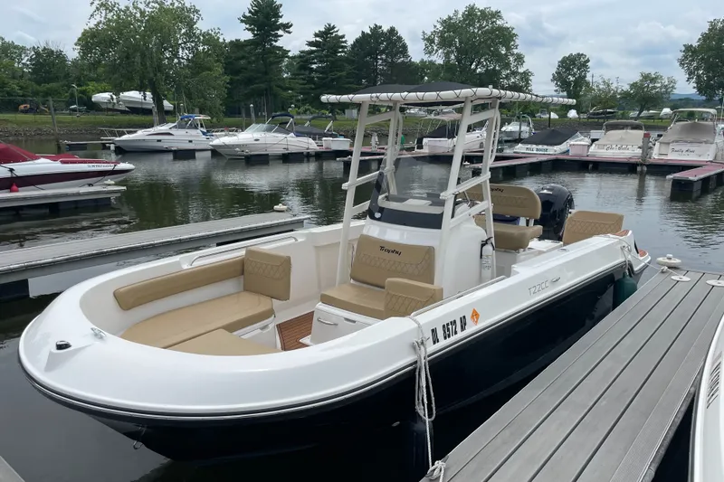Slide: The Image of 2024 Trophy CC22 boat docked at marina, featuring sleek design and comfortable seating. - 3