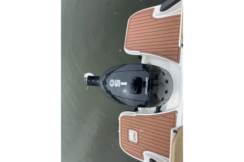 Slide: The Image of 2024 Trophy CC22 boat with Mercury outboard motor on water. - 7