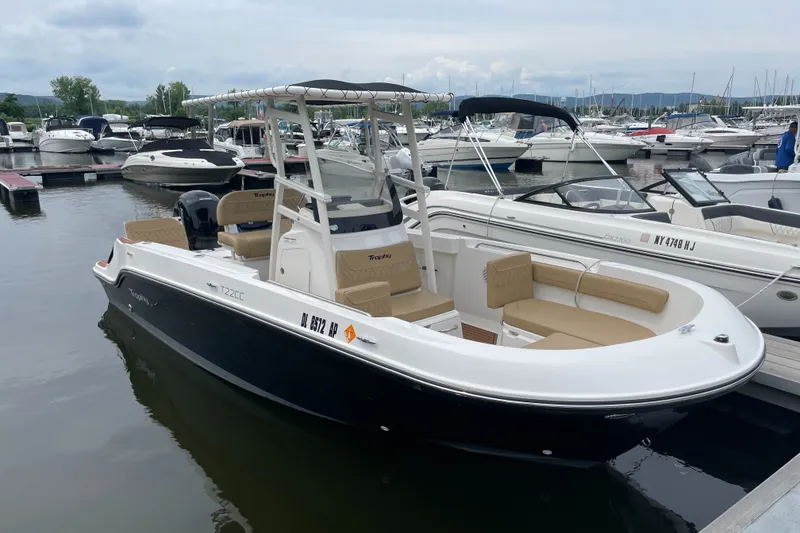 The Image of 2024 Trophy CC22 boat docked at marina, featuring sleek design and comfortable seating. - 2