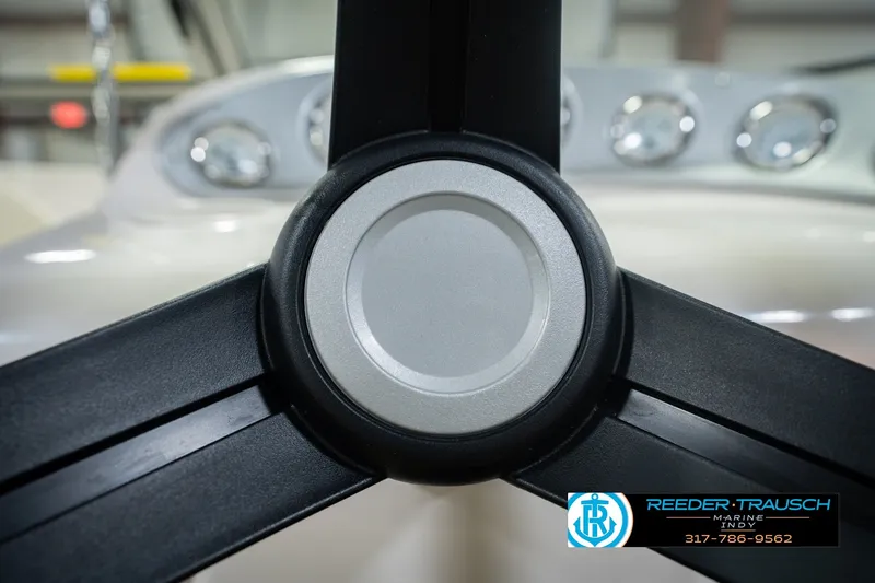 Slide: The Image of Steering wheel of 2006 Starcraft C-Star 1700 I/O F&S boat, Reeder-Trausch Marine logo visible. - 34