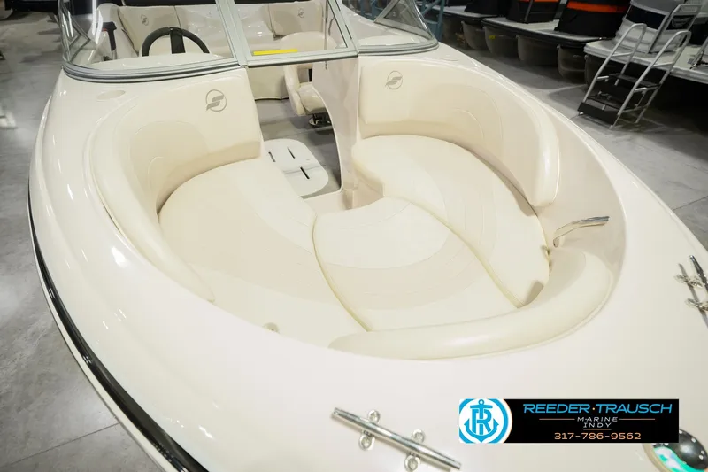 Slide: The Image of 2006 Starcraft C-Star 1700 I/O F&S boat interior with cream seating and steering wheel. - 13