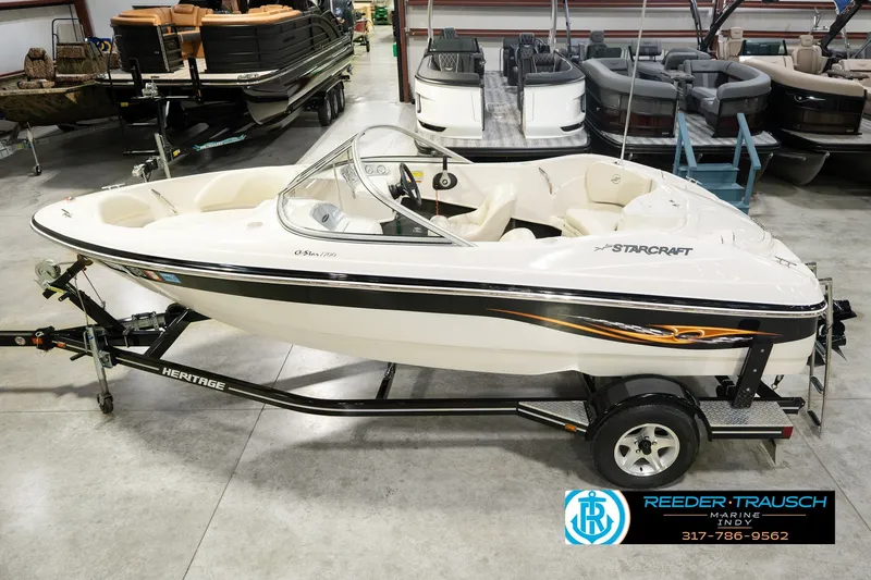The Image of 2006 Starcraft C-Star 1700 I/O F&S boat on trailer in showroom. - 0