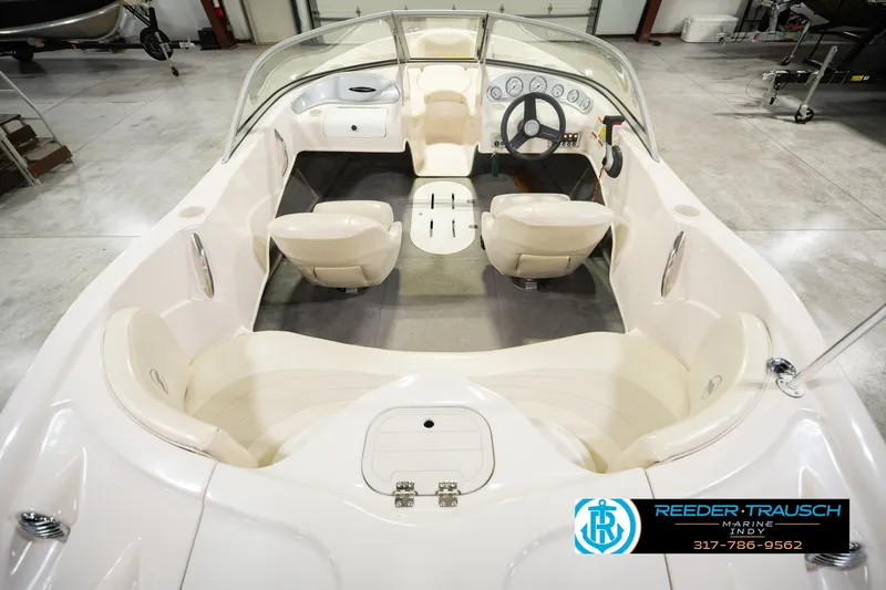 Slide: The Image of 2006 Starcraft C-Star 1700 I/O F&S boat interior with steering wheel and seating. - 17