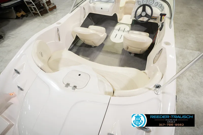 Slide: The Image of 2006 Starcraft C-Star 1700 I/O F&S boat interior with seating and steering wheel. - 14