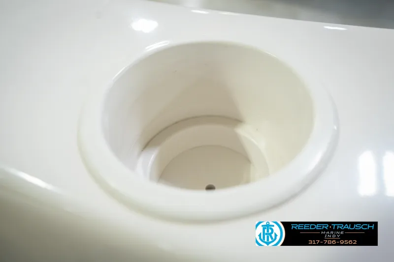 Slide: The Image of Cup holder on 2006 Starcraft C-Star 1700 I/O F&S boat, Reeder-Trausch Marine logo visible. - 46
