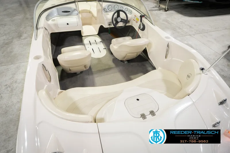 Slide: The Image of 2006 Starcraft C-Star 1700 I/O F&S boat interior with beige seating and steering wheel. - 16