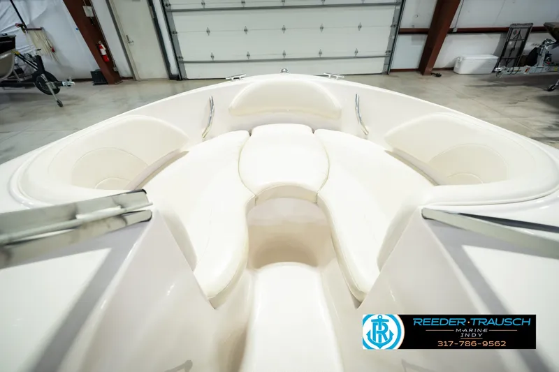 Slide: The Image of 2006 Starcraft C-Star 1700 I/O F&S boat interior with white seating in a showroom. - 29