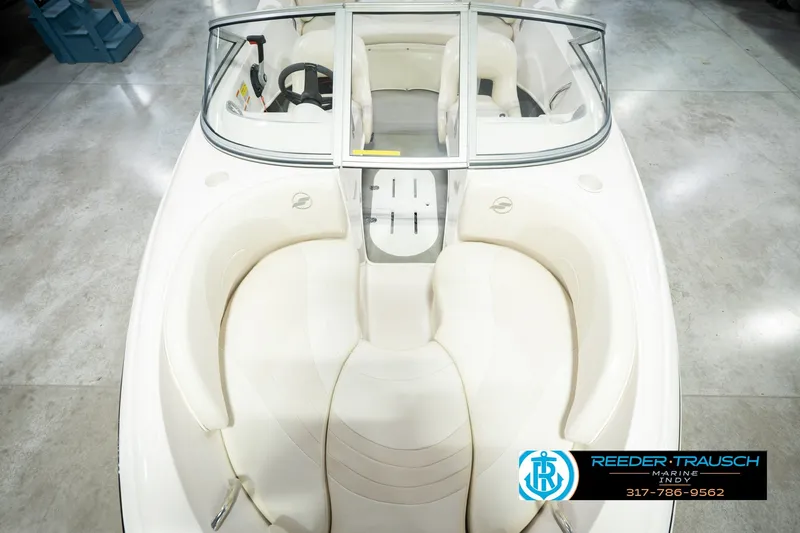 Slide: The Image of 2006 Starcraft C-Star 1700 I/O F&S boat interior with white seating and steering wheel. - 21