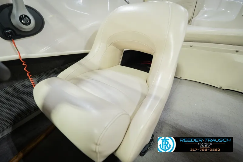 Slide: The Image of 2006 Starcraft C-Star 1700 I/O F&S boat seat with steering wheel and branding. - 43