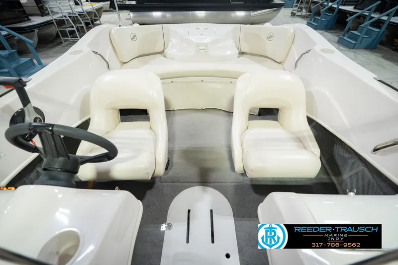Slide: The Image of 2006 Starcraft C-Star 1700 I/O F&S boat interior with white seating and steering wheel. - 22
