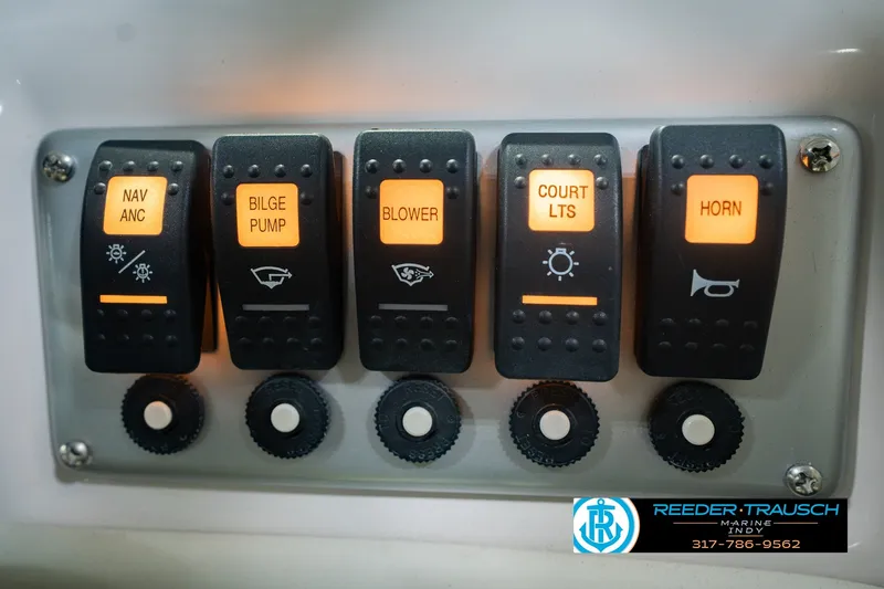 Slide: The Image of Control panel of a 2006 Starcraft C-Star 1700 I/O F&S boat with illuminated switches. - 41