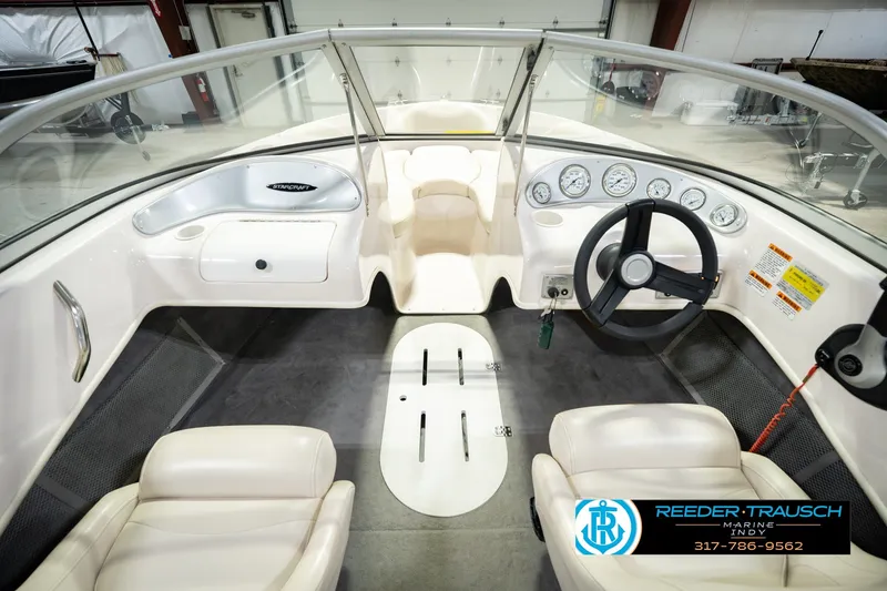 Slide: The Image of 2006 Starcraft C-Star 1700 I/O F&S boat interior with steering wheel and dashboard gauges. - 18