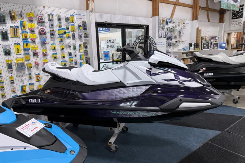 The Image of 2026 Yamaha WaveRunner VX Cruiser HO displayed in a showroom with accessories. - 0