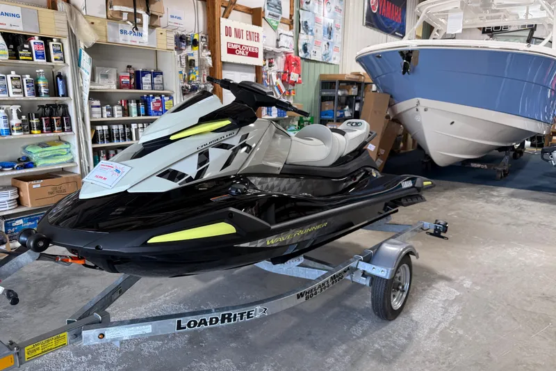 Slide: The Image of 2026 Yamaha WaveRunner VX Cruiser HO on trailer in a marine shop. - 1