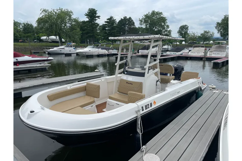 The Image of 2024 Trophy CC22 boat docked at marina, featuring sleek design and spacious seating. - 1