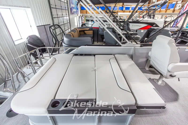 Slide: The Image of 2026 Godfrey Monaco 235 SFLC pontoon boat interior with plush seating at Lakeside Marina. - 24