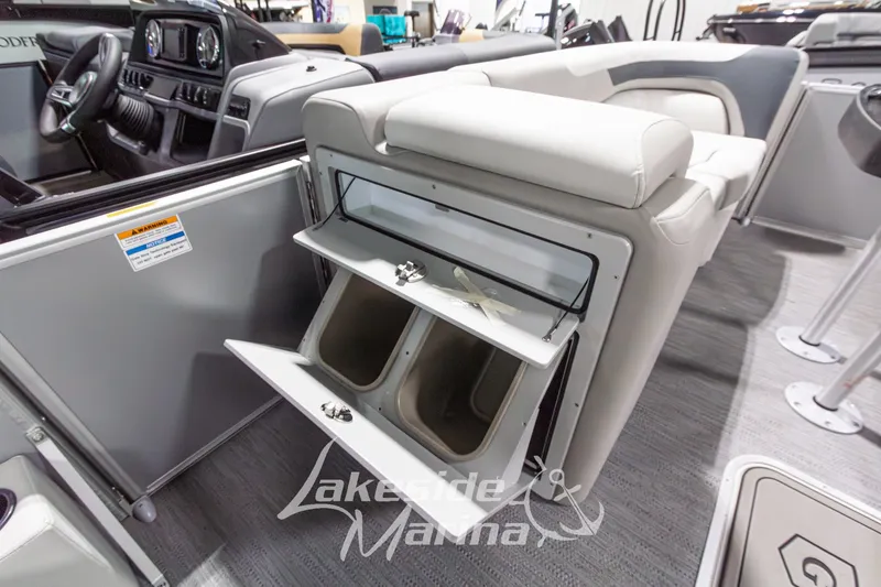 Slide: The Image of Interior of 2026 Godfrey Monaco 235 SFLC boat with open storage compartments. - 13
