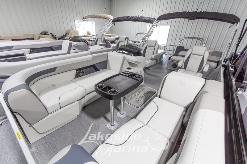 Slide: The Image of Luxurious 2026 Godfrey Monaco 235 SFLC pontoon boat interior with plush seating and modern design. - 4