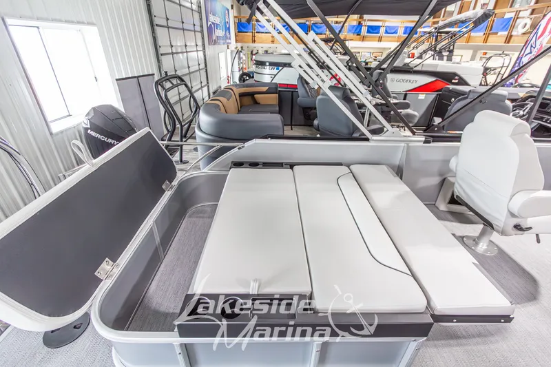 Slide: The Image of 2026 Godfrey Monaco 235 SFLC pontoon boat interior with seating and storage at Lakeside Marina. - 26