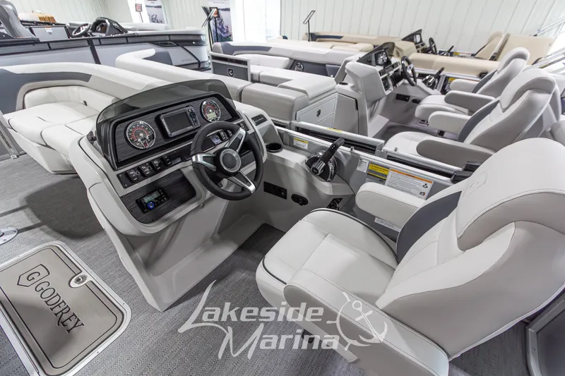 Slide: The Image of Interior of 2026 Godfrey Monaco 235 SFLC boat with modern dashboard and seating. - 15