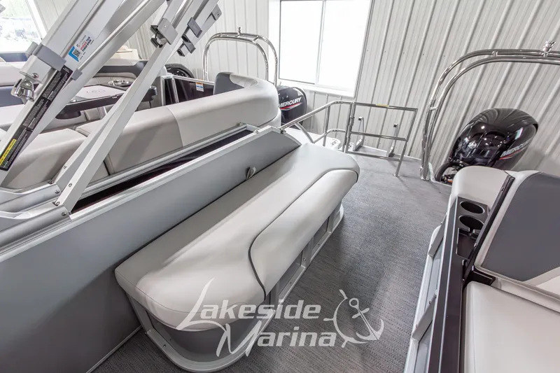 Slide: The Image of 2026 Godfrey Monaco 235 SFLC pontoon boat interior with seating and Mercury engine. - 20
