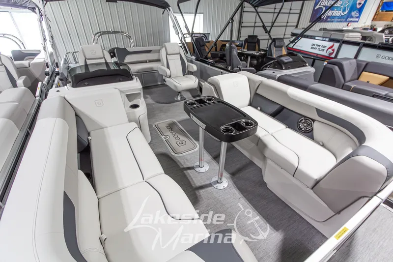 Slide: The Image of Luxurious interior of 2026 Godfrey Monaco 235 SFLC pontoon boat with plush seating. - 2