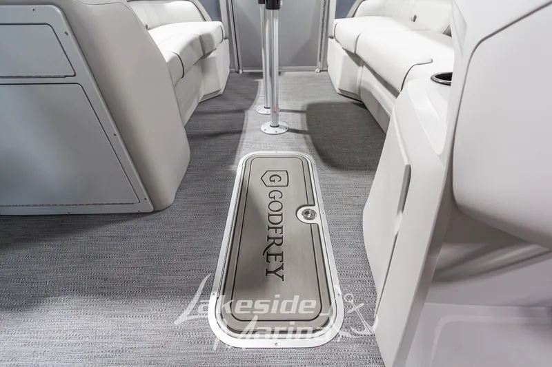 Slide: The Image of Interior of 2026 Godfrey Monaco 235 SFLC boat with sleek seating and branded flooring. - 7